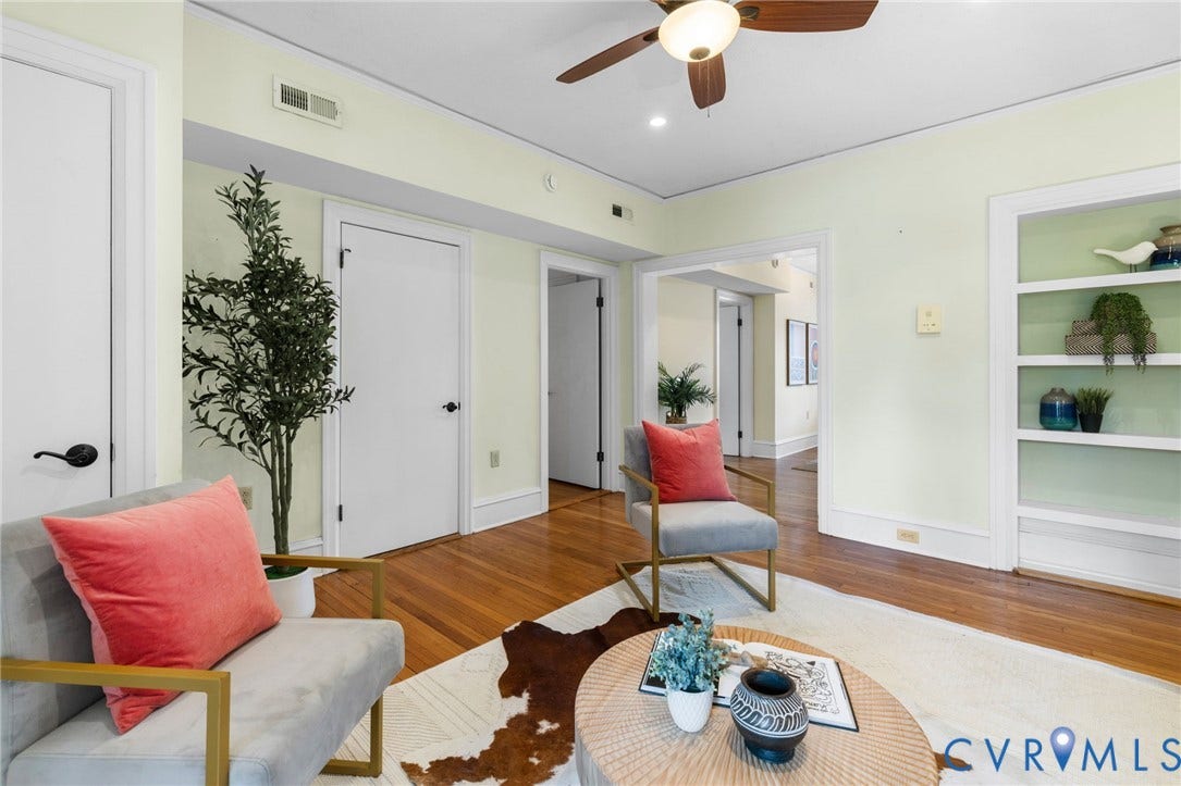 Hardwood flooring, ceiling fan, white trim, recessed built-in shelving