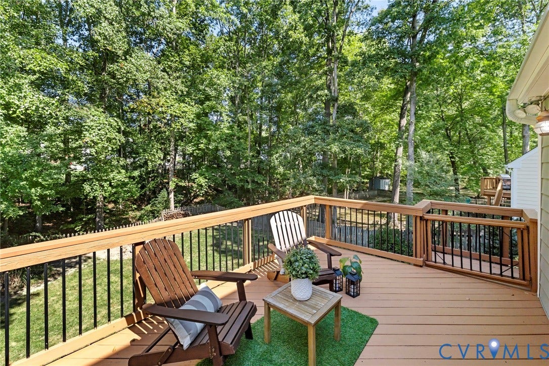 2308 Strangford Court, Henrico, VA 23233 Spacious wood-tone deck with black metal balusters and wood railings