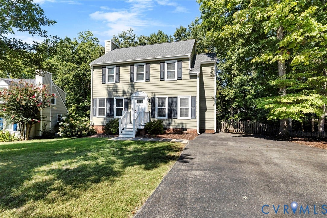 2308 Strangford Court, Henrico, VA 23233 Two-story colonial-style residence featuring a prominent front porch, a well-maintained lawn, and mature trees providing natural shading
