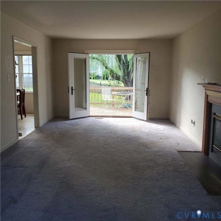 French doors opening to an exterior wood deck