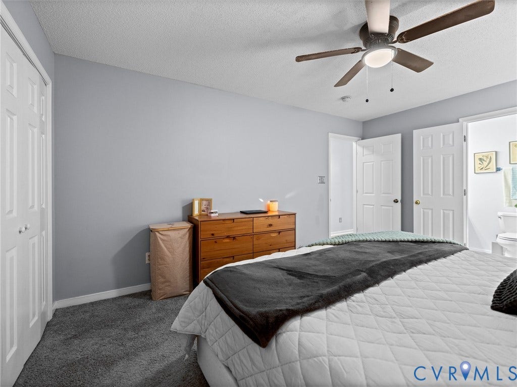 6712 N Hedges Road, Chesterfield, VA 23224 Spacious room featuring neutral carpeting, light gray wall paint, and a ceiling fan with integrated lighting