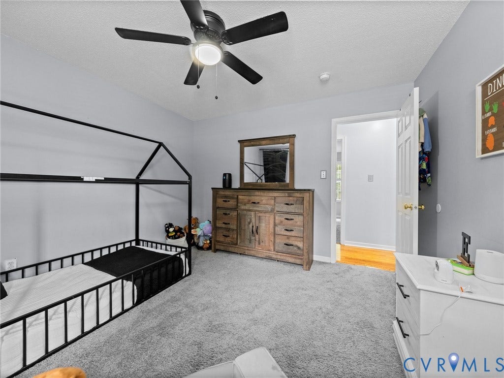 6712 N Hedges Road, Chesterfield, VA 23224 Spacious room featuring light gray walls and plush gray carpeting