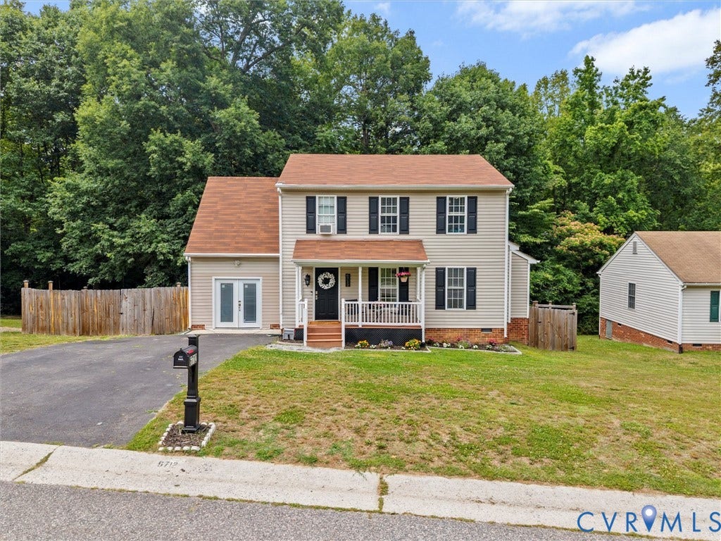 6712 N Hedges Road, Chesterfield, VA 23224 Two-story residence featuring light-colored siding, black shutters, and a covered front porch with white railing