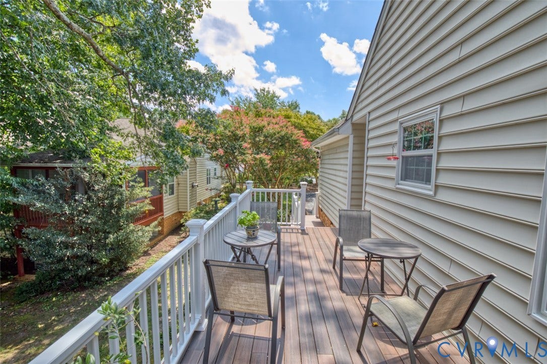 6311 Chiswick Park, Williamsburg, VA 23188 Expansive outdoor deck with composite decking, white railing, and exterior siding