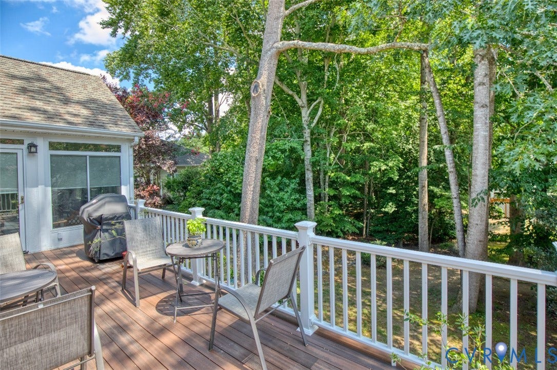 6311 Chiswick Park, Williamsburg, VA 23188 Wood-finish decking with white railing overlooking mature trees