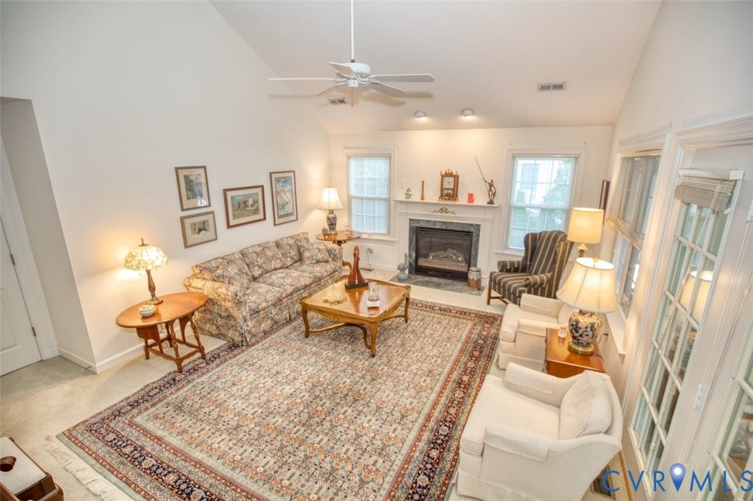 6311 Chiswick Park, Williamsburg, VA 23188 Vaulted ceiling with a ceiling fan, fireplace with a mantel, recessed lighting, and multiple windows