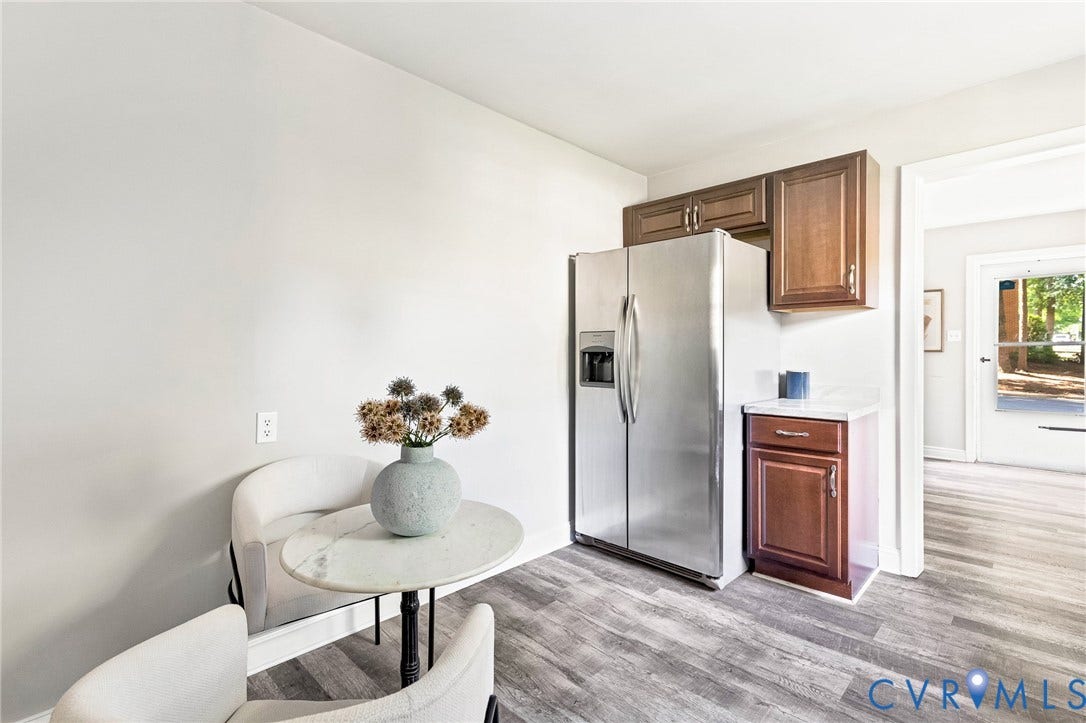 2807 Rothland Drive, Henrico, VA 23294 Stainless steel refrigerator, wood-finish flooring, wood cabinetry, and a white countertop
