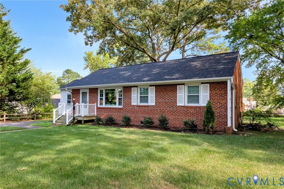 2807 Rothland Drive, Henrico, VA 23294 Brick exterior with white window shutters and a dark shingle roof
