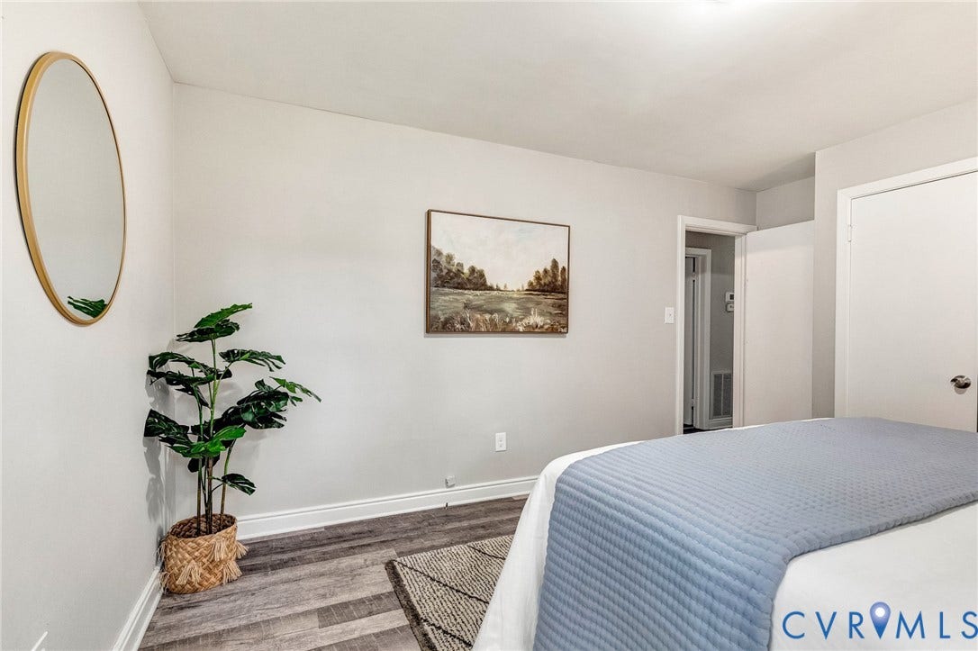 2807 Rothland Drive, Henrico, VA 23294 Light gray wall paint, wood-finish flooring, white trim, recessed lighting, and a white interior door