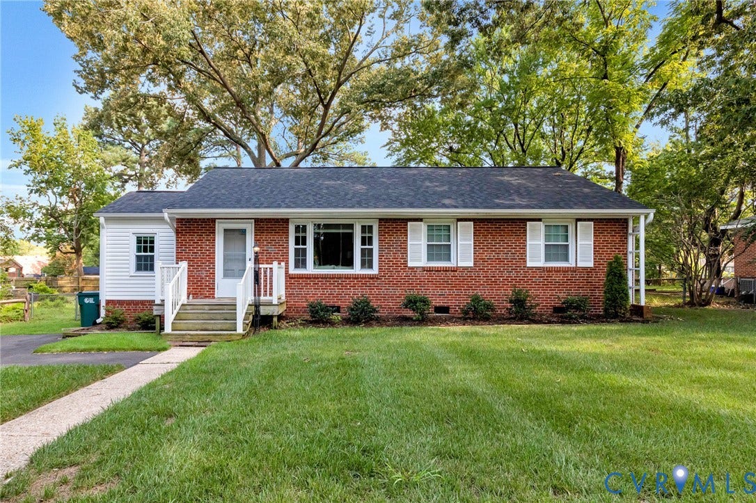 2807 Rothland Drive, Henrico, VA 23294 Brick and siding exterior featuring white shutters and trim