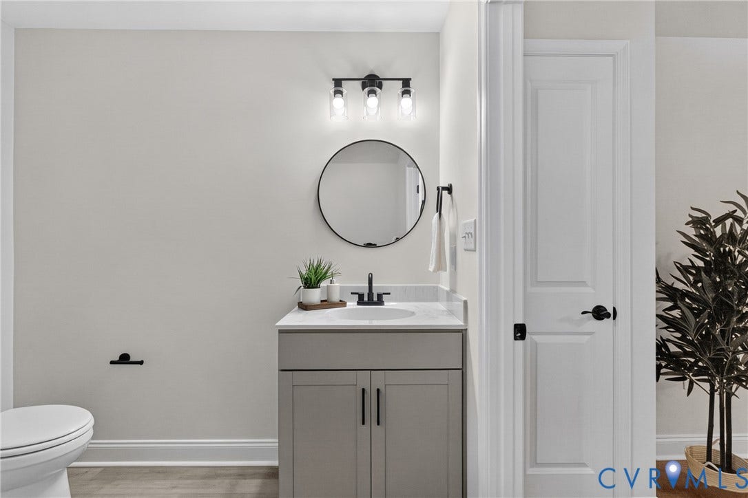6537 Hardee Haven Place, Midlothian, VA 23112 Modern vanity with a gray finish, white countertop, and matte black faucet
