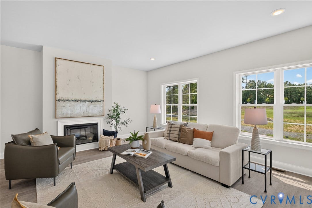 6537 Hardee Haven Place, Midlothian, VA 23112 Recessed lighting, wood-finish flooring, white walls, and a built-in fireplace with a white mantel and surround