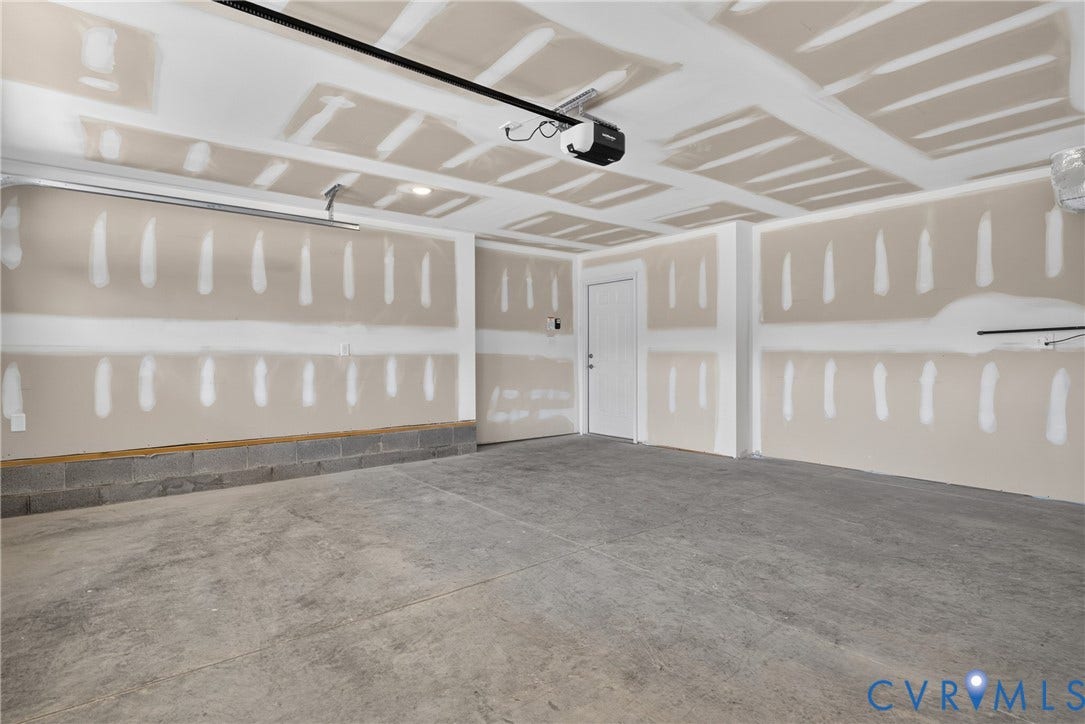 6537 Hardee Haven Place, Midlothian, VA 23112 Concrete flooring, drywall-ready walls, white panel door, exposed ceiling joists, garage door mechanism