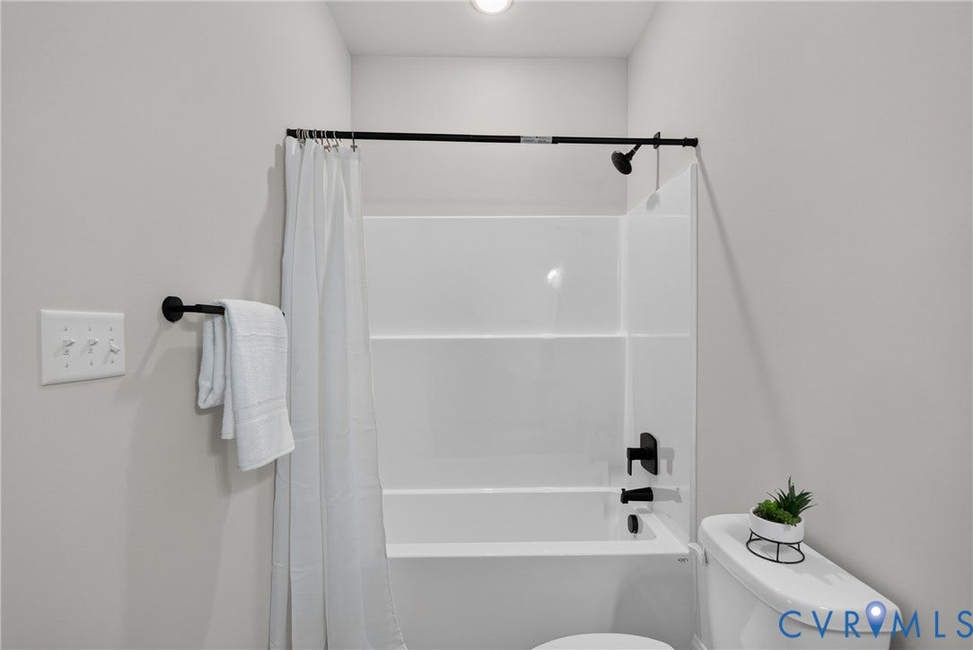 6537 Hardee Haven Place, Midlothian, VA 23112 White acrylic tub and shower combination with matte black fixtures