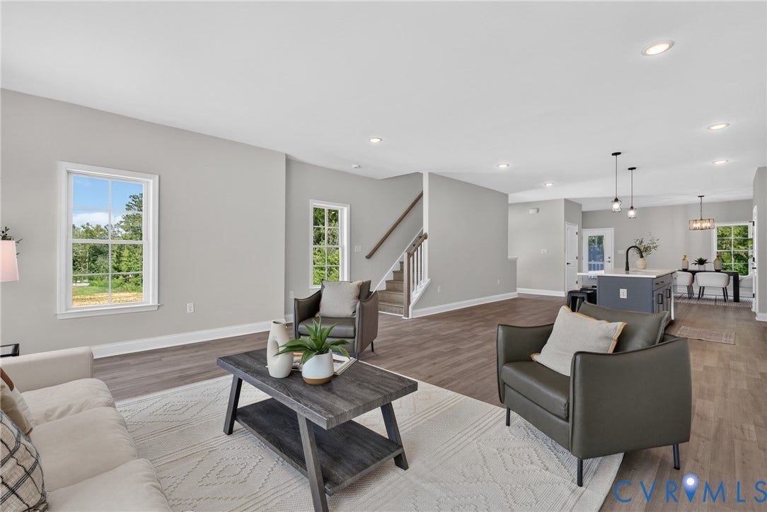 6537 Hardee Haven Place, Midlothian, VA 23112 Open-concept living area with wood-finish flooring, recessed lighting, and multiple windows