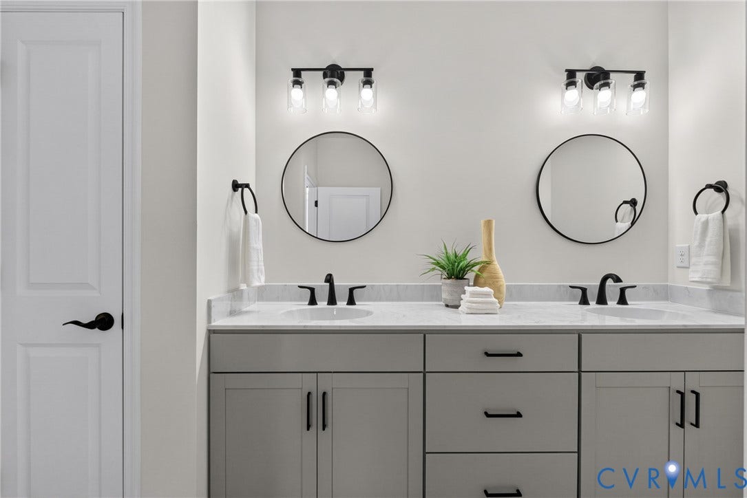 6537 Hardee Haven Place, Midlothian, VA 23112 Double vanity with light gray cabinetry, white countertops, dual integrated sinks, and individual round mirrors