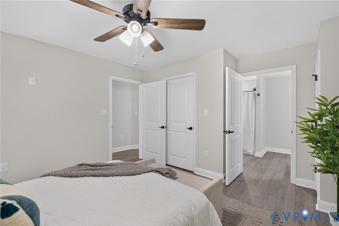 6537 Hardee Haven Place, Midlothian, VA 23112 Ceiling fan with wood-finish blades, light gray walls, wood-finish flooring, white paneled doors, and matte black hardware