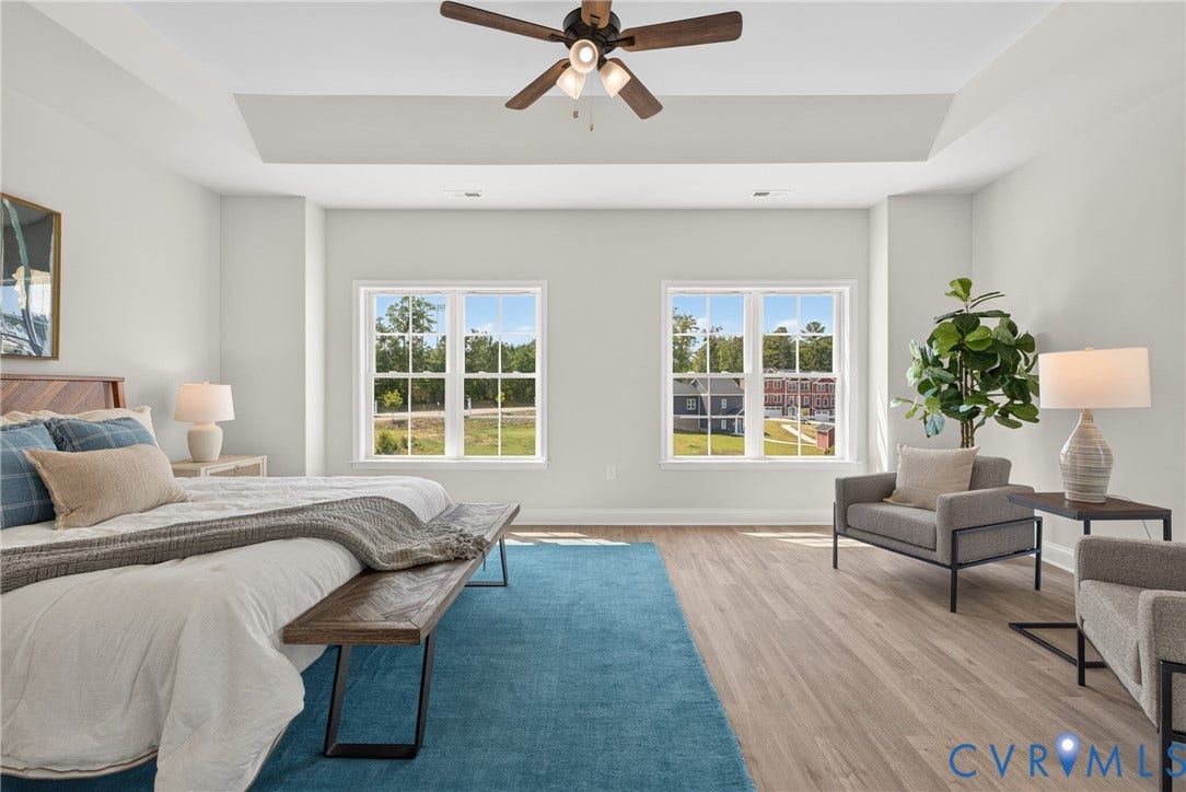 6537 Hardee Haven Place, Midlothian, VA 23112 Tray ceiling with a ceiling fan, two double-hung windows, and wood-finish flooring