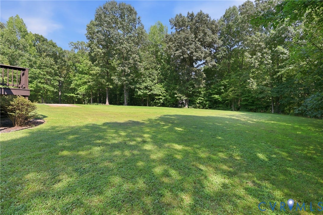 5295 Chimney Springs Drive, Saunders Acres, Goochland, VA 23063 Expansive green lawn surrounded by mature trees