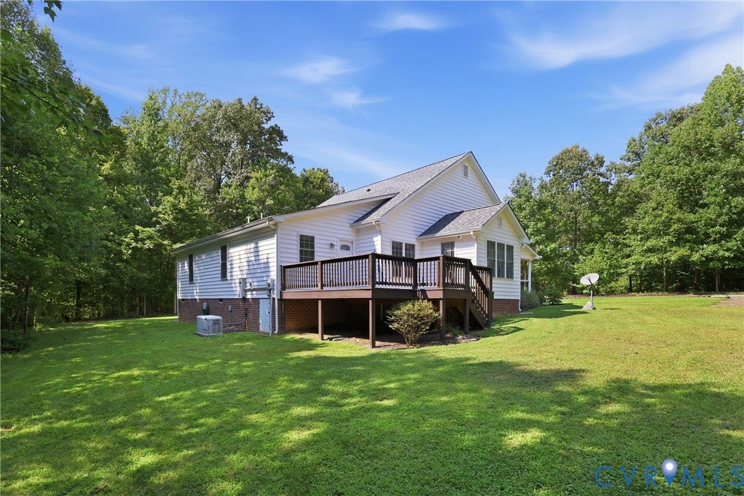 5295 Chimney Springs Drive, Saunders Acres, Goochland, VA 23063 Expansive green lawn with mature trees bordering the property