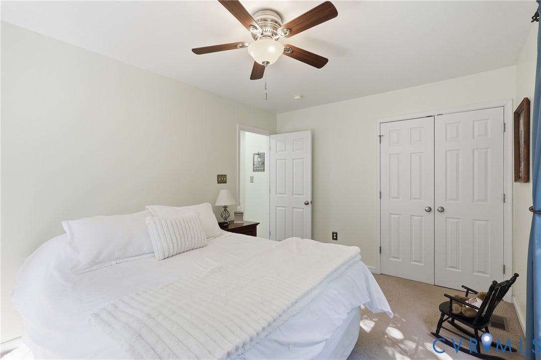5295 Chimney Springs Drive, Saunders Acres, Goochland, VA 23063 Recessed lighting, ceiling fan with wood-finish blades, soft neutral wall color, carpeted flooring, and white bi-fold closet doors