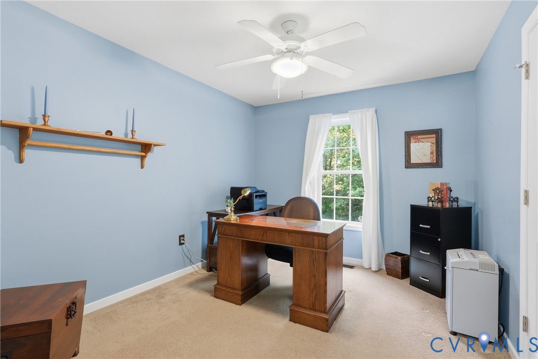 5295 Chimney Springs Drive, Saunders Acres, Goochland, VA 23063 Recessed window, ceiling fan with integrated lighting, wood-finish shelving, and neutral carpeting