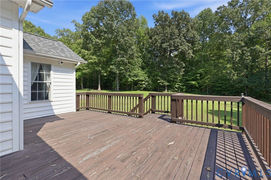 5295 Chimney Springs Drive, Saunders Acres, Goochland, VA 23063 Expansive wood deck with a perimeter railing, offering an open outdoor living area