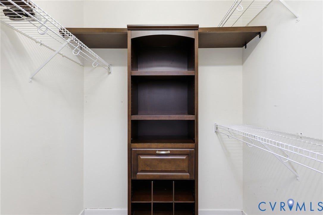 5295 Chimney Springs Drive, Saunders Acres, Goochland, VA 23063 Custom dark wood-finish built-in storage with open shelving and a drawer