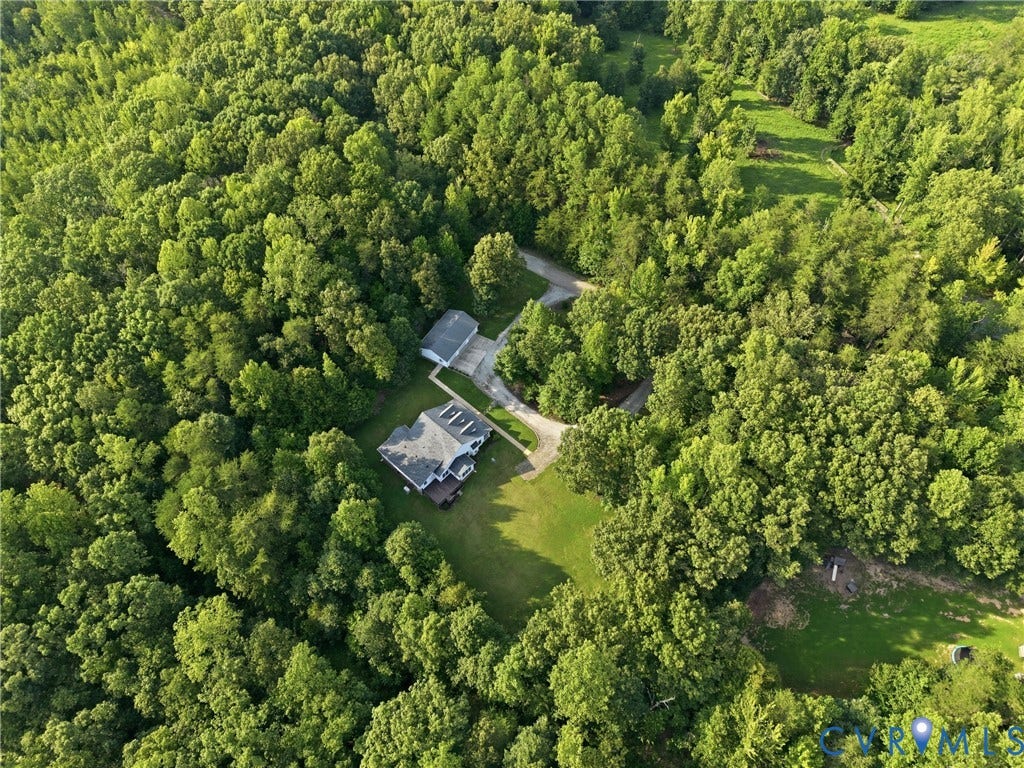 5295 Chimney Springs Drive, Saunders Acres, Goochland, VA 23063 Expansive tree-covered landscape with a residential structure, detached garage, and a winding driveway