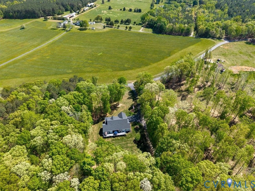 3060 Moyer Road, Powhatan, VA 23139 Secluded residence nestled within mature woodland setting, featuring a dark-exterior home surrounded by dense tree coverage