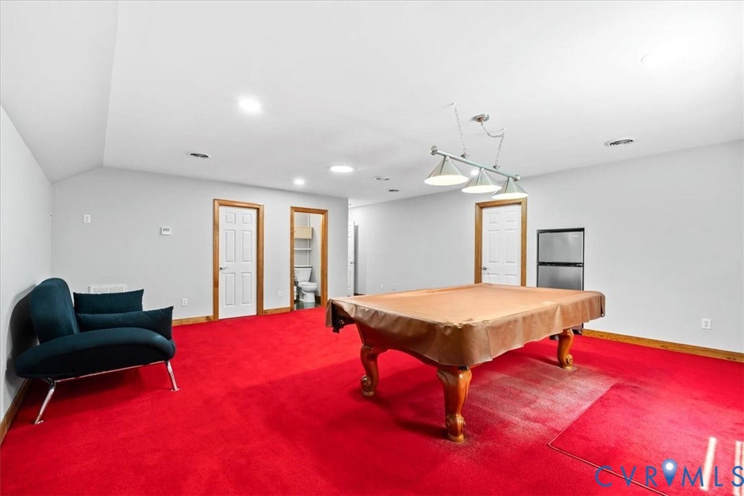 3060 Moyer Road, Powhatan, VA 23139 Recessed ceiling lighting, track lighting fixture, white interior doors, wood trim, and a built-in beverage refrigerator
