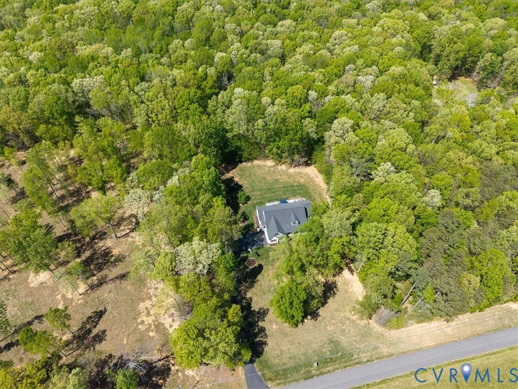 3060 Moyer Road, Powhatan, VA 23139 Expansive wooded acreage featuring a dedicated residential clearing and a paved driveway approach