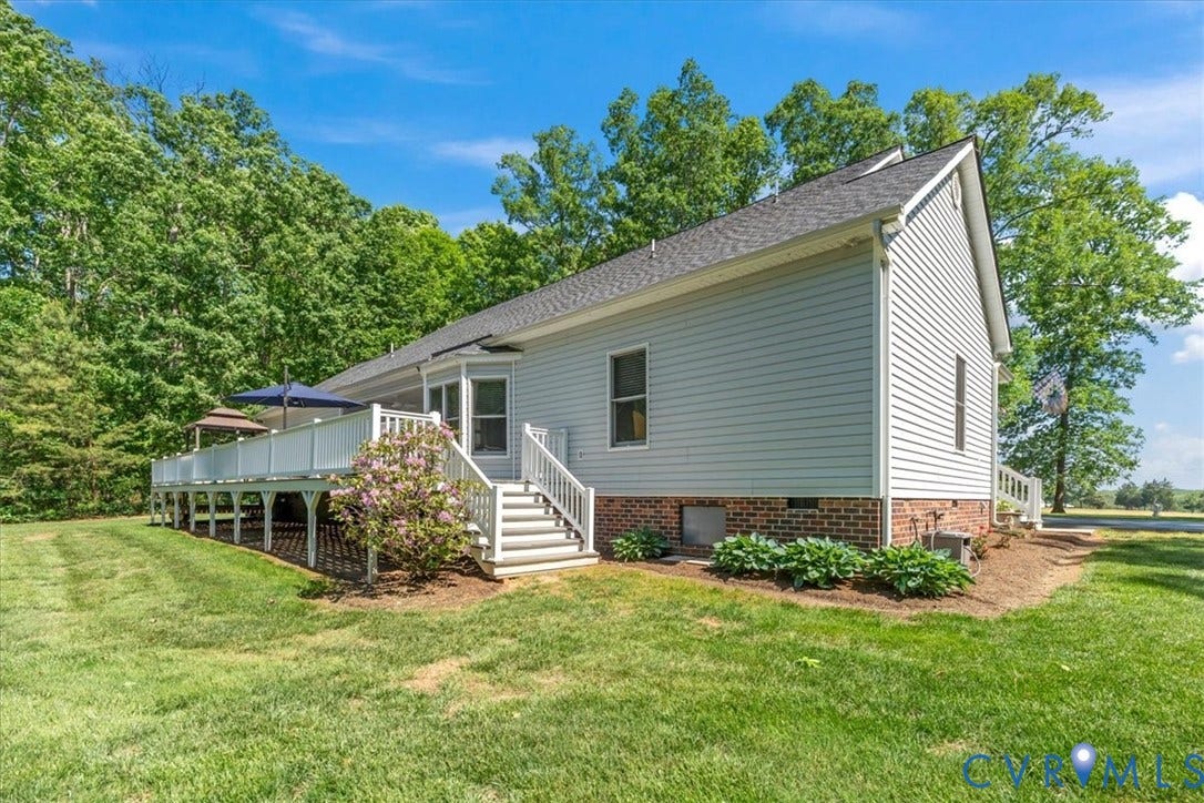 3060 Moyer Road, Powhatan, VA 23139 Expansive wood deck with white railings and steps