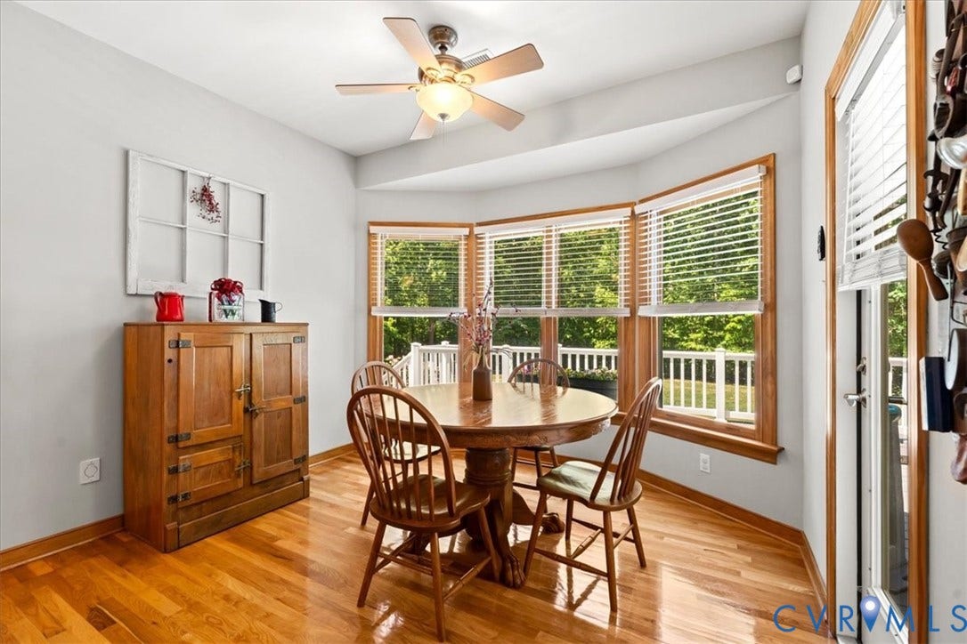 3060 Moyer Road, Powhatan, VA 23139 Hardwood flooring throughout, with a bay window offering ample natural light