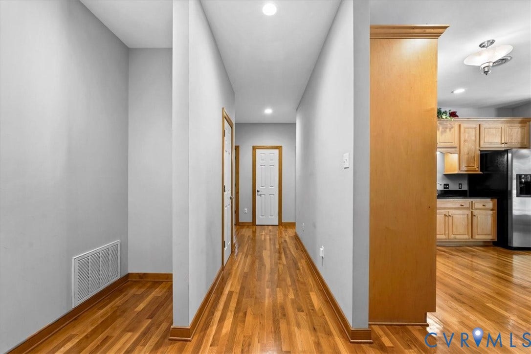 3060 Moyer Road, Powhatan, VA 23139 Hardwood flooring throughout, recessed lighting, wood-finish trim, and light gray wall tones