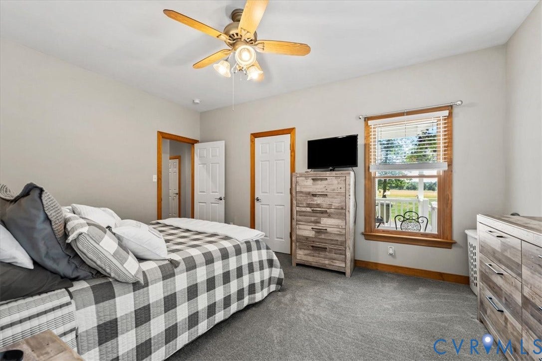 3060 Moyer Road, Powhatan, VA 23139 Carpeted flooring, white interior doors, wood-trimmed windows, a ceiling fan with integrated lighting, and neutral wall paint