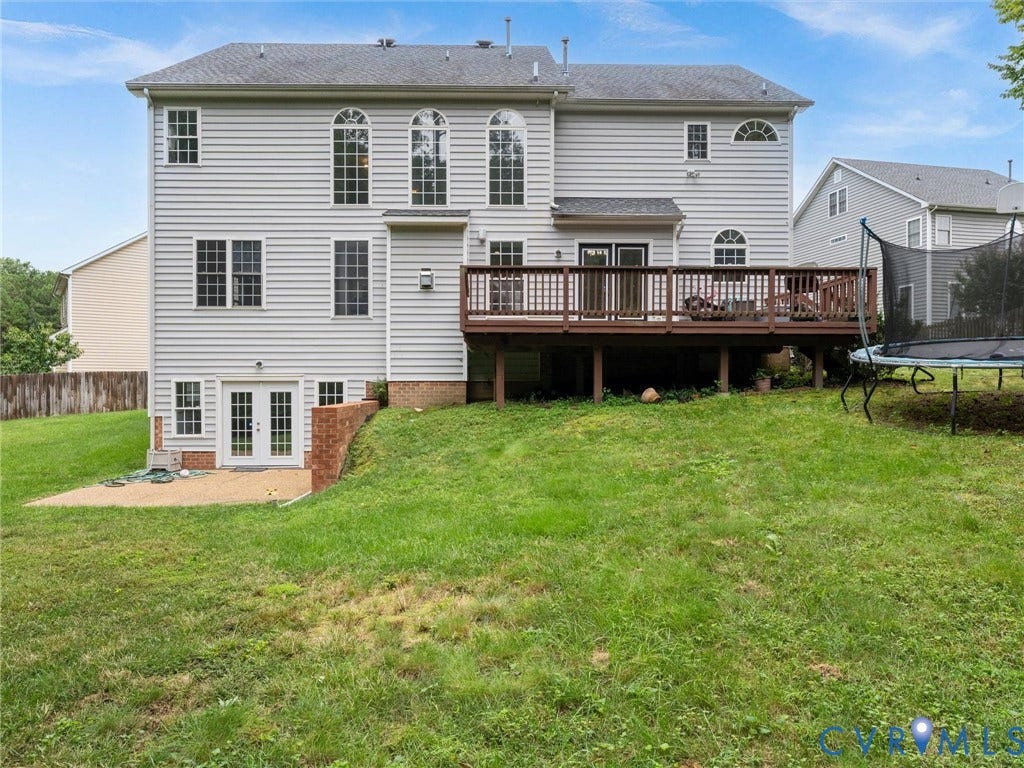 5017 Sadler Glen Place, Glen Allen, VA 23060 Exterior featuring light-colored siding, a multi-level deck, French doors, and an arched window design