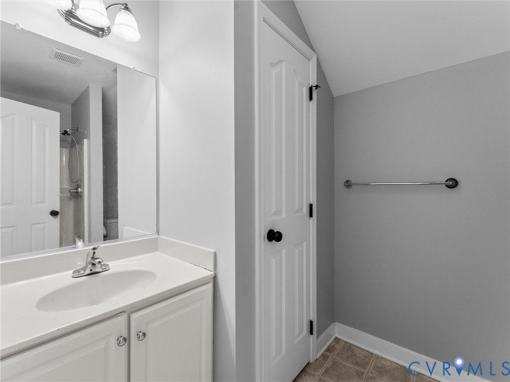 5017 Sadler Glen Place, Glen Allen, VA 23060 3rd floor bathroom White vanity with integrated sink, chrome faucet, and overhead two-light fixture