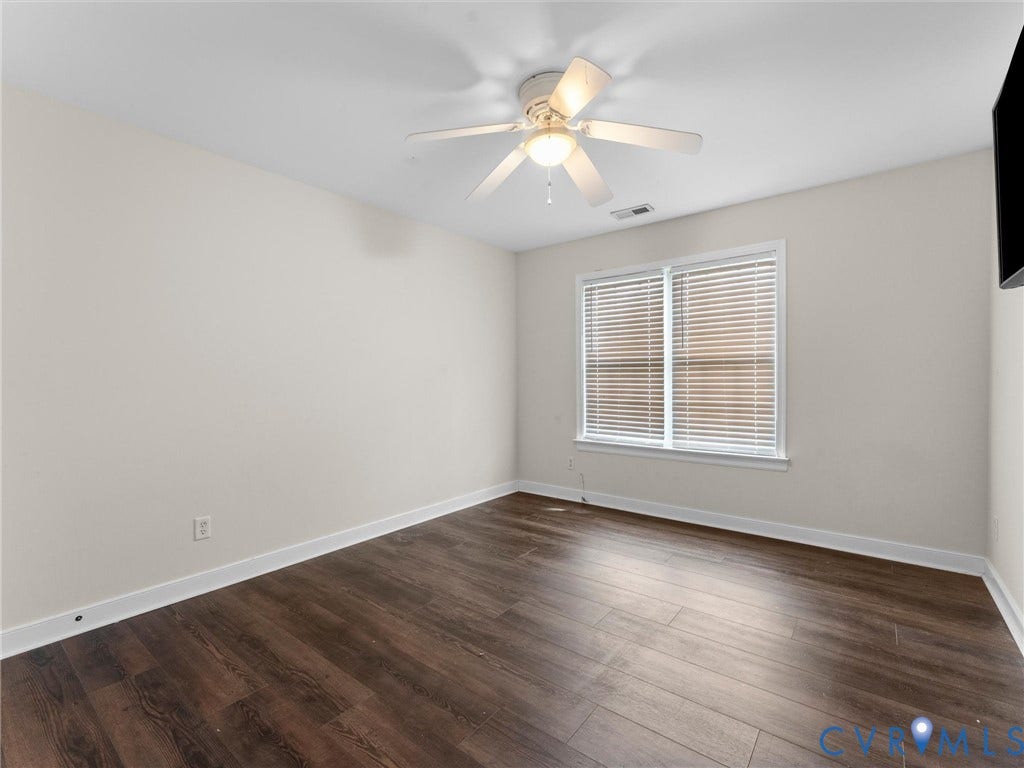 5017 Sadler Glen Place, Glen Allen, VA 23060 Wood-finish flooring with crisp white trim, ceiling fan, and a window with horizontal blinds