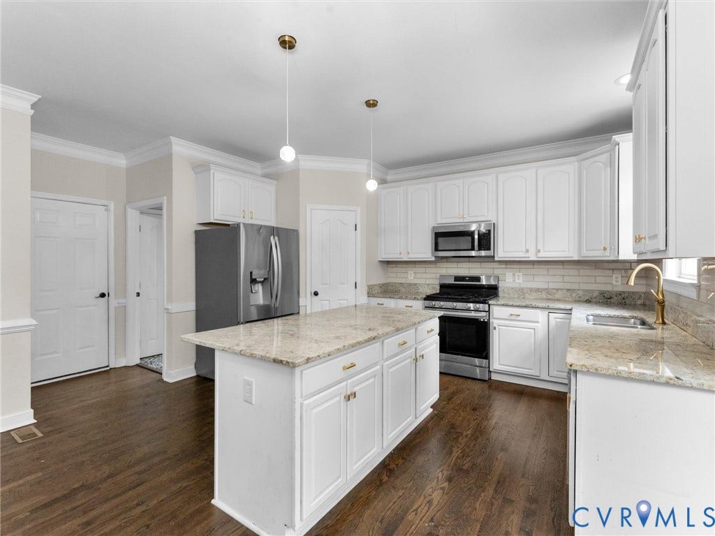 5017 Sadler Glen Place, Glen Allen, VA 23060 Kitchen featuring a central island, white cabinetry, stainless steel appliances, granite countertops, and wood-finish flooring