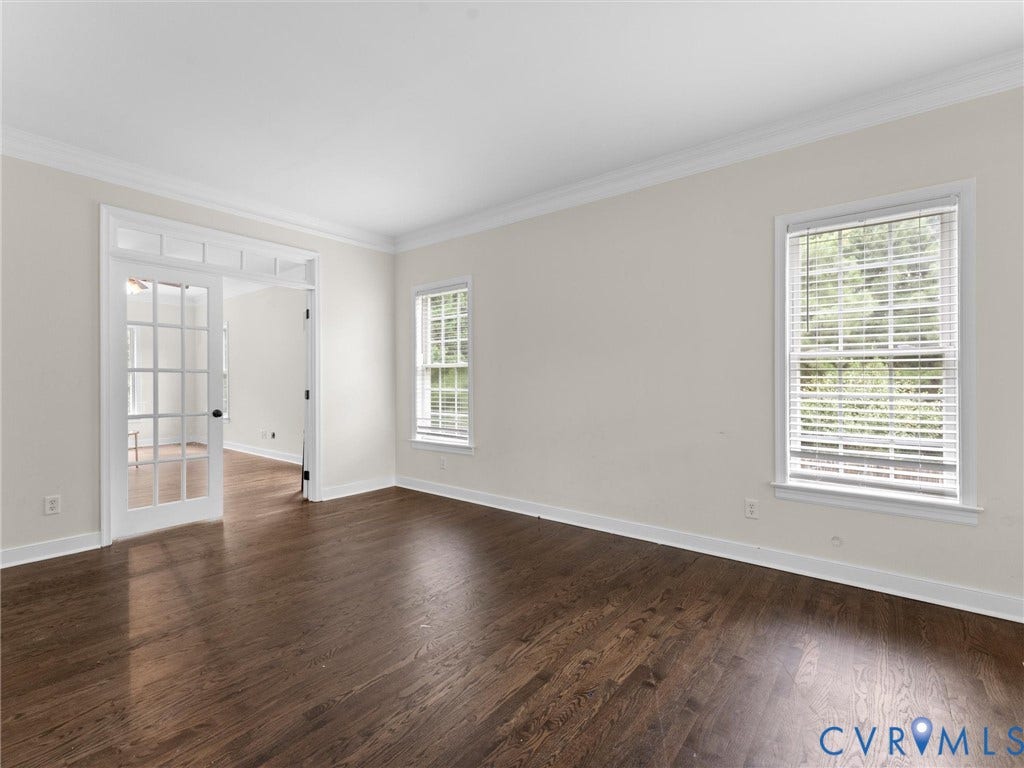 5017 Sadler Glen Place, Glen Allen, VA 23060 Dark wood-finish flooring with white baseboards and crown molding