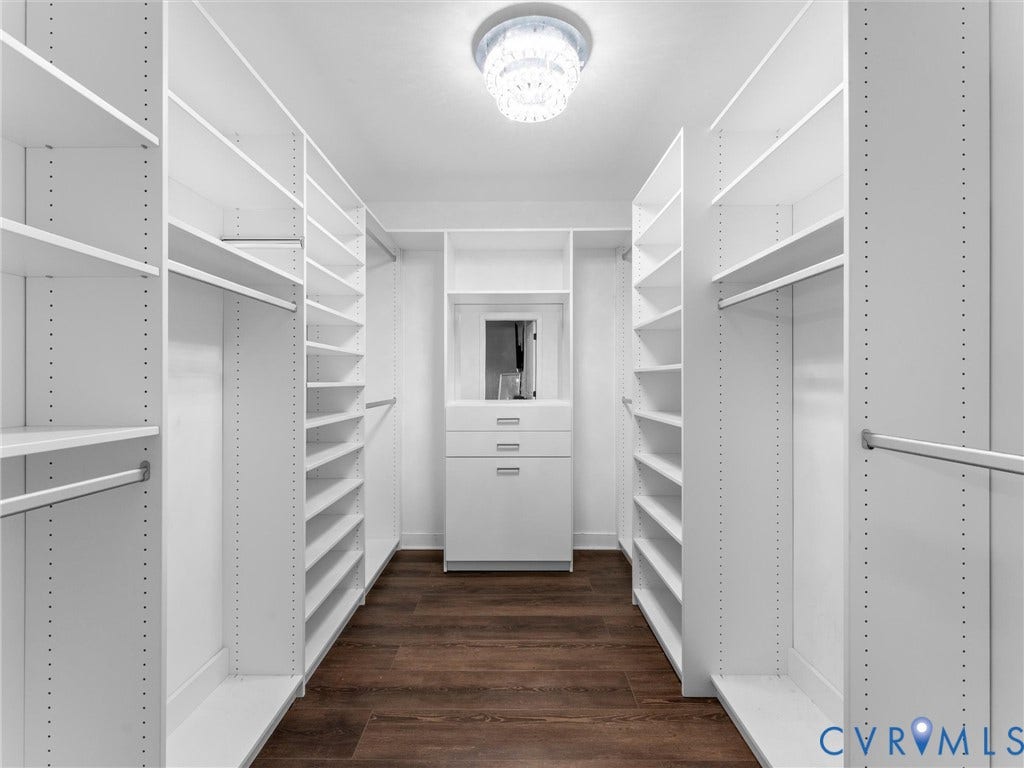 5017 Sadler Glen Place, Glen Allen, VA 23060 Custom white built-in storage with shelving, hanging rods, and a central dresser unit