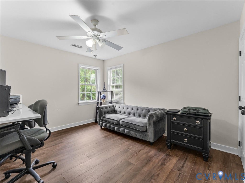 5017 Sadler Glen Place, Glen Allen, VA 23060 2nd floor bedroom Wood-finish flooring throughout, complemented by a ceiling fan with integrated lighting