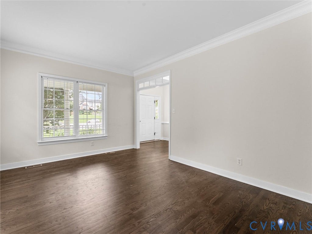 5017 Sadler Glen Place, Glen Allen, VA 23060 Wood-finish flooring, white wall paint, crown molding, double-hung window, and a white interior door with transom