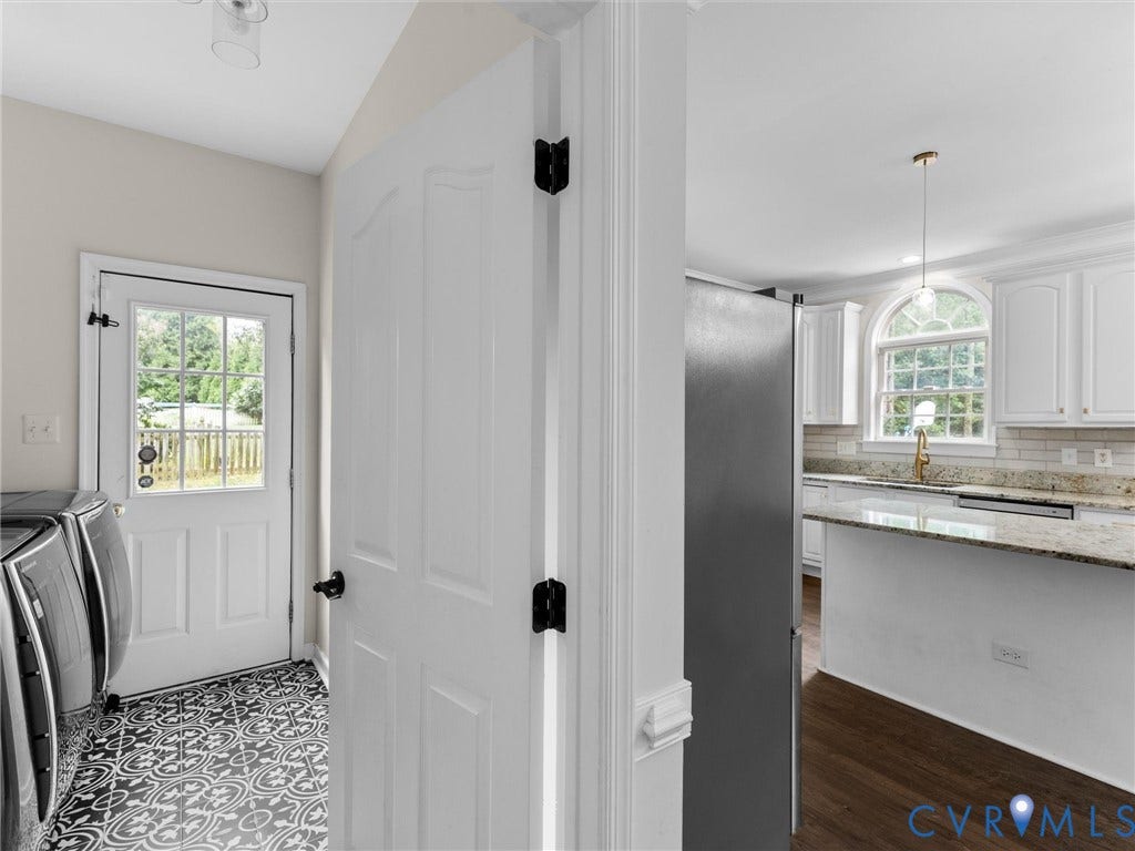 5017 Sadler Glen Place, Glen Allen, VA 23060 Patterned floor tile, exterior door with glass panes, white interior doors, kitchen with white cabinetry, arched window