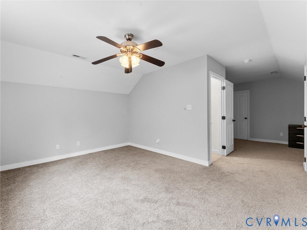 5017 Sadler Glen Place, Glen Allen, VA 23060 Vaulted ceiling with an attached ceiling fan, neutral wall paint, and carpet flooring
