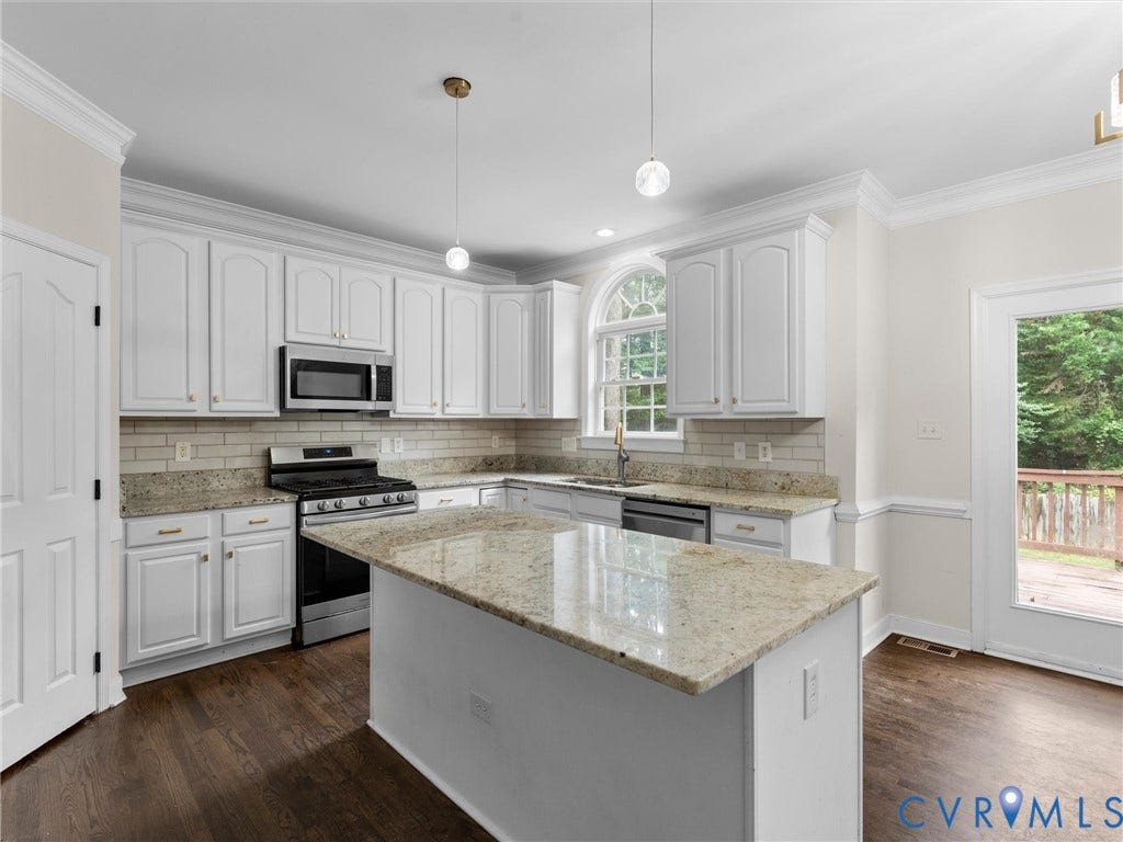 5017 Sadler Glen Place, Glen Allen, VA 23060 White cabinetry, granite countertops, subway tile backsplash, stainless steel appliances, and dark wood-finish flooring