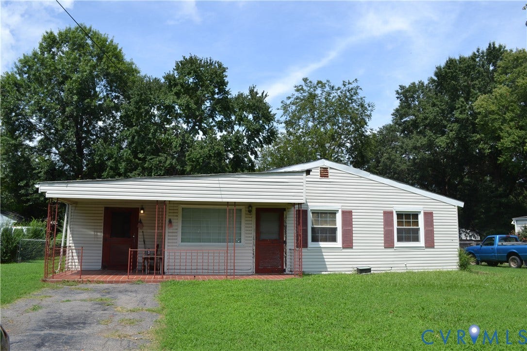 3024 Bensley Road, Ampthill, VA 23237 Light-colored siding exterior with a covered porch