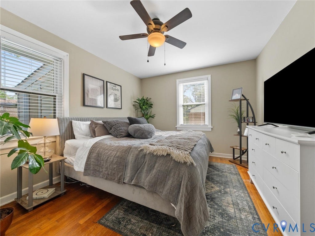 2328 Leah Road, Richmond, VA 23230 Hardwood-finish flooring, ceiling fan with integrated lighting, two windows with blinds, and neutral wall tones
