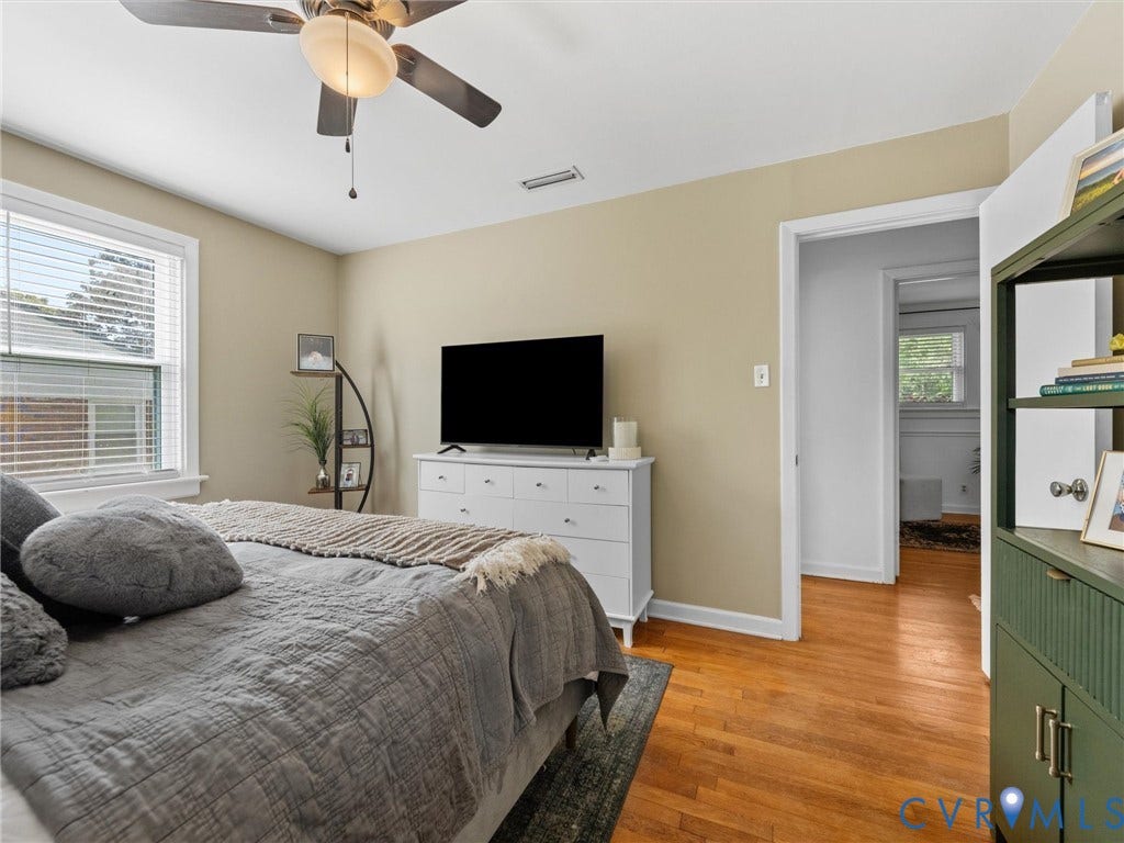 2328 Leah Road, Richmond, VA 23230 Hardwood flooring, ceiling fan with integrated lighting, a window with blinds, and painted walls